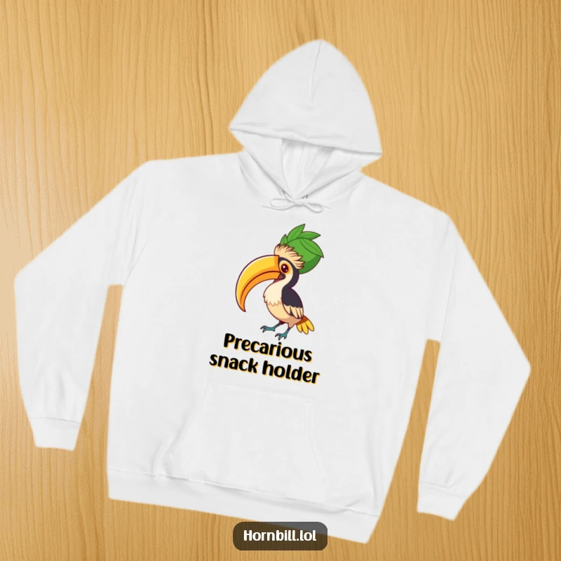 Funny Hornbill Fruit Balancer Hoodie, showing a concentrated bird balancing a large fruit, symbolizing determination and warmth.