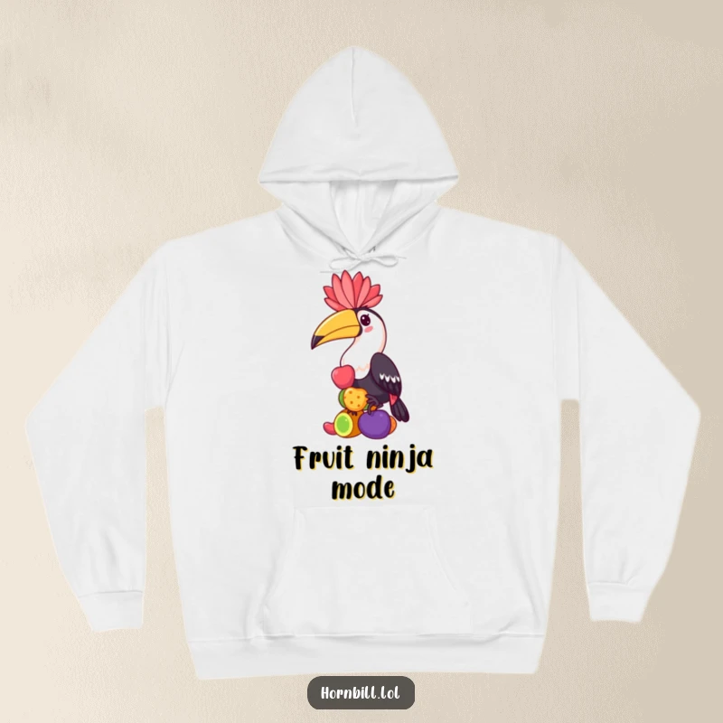Funny hornbill hoodie, a kawaii bird character balancing a stack of colorful fruits, offering warmth and whimsical art.