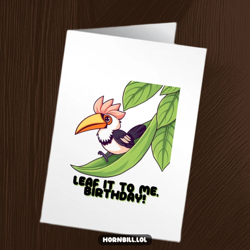 Funny Free Printable Birthday Card: Kawaii hornbill gleefully sliding down a lush green leaf like a playground slide.