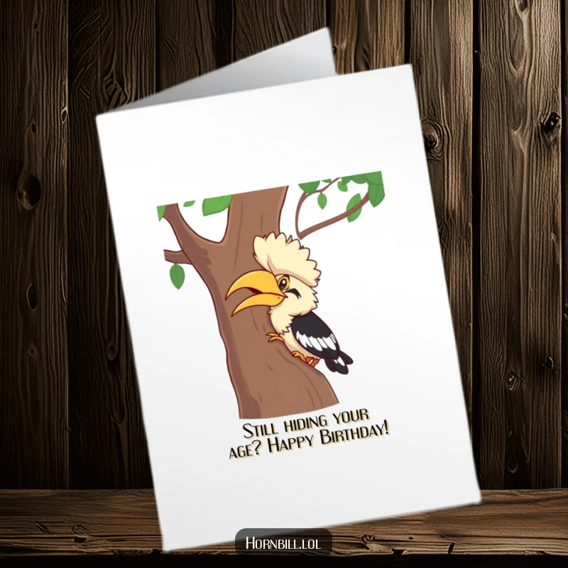 Funny Free Printable Hornbill Hide-and-Seek Birthday Card: A giggling bird peeks from behind a tree, ready for fun.