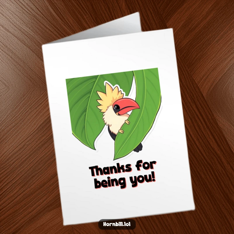 Funny Free Printable Thank You Card: Adorable chubby hornbill peeking shyly from behind a large green leaf, saying thank you.