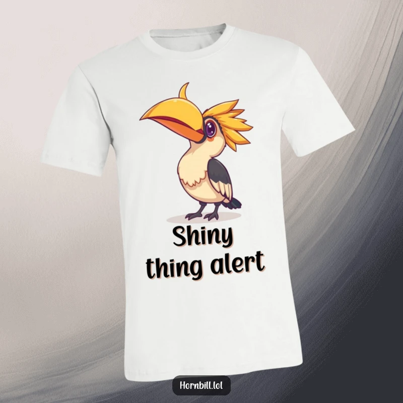 Funny t-shirt print of a hornbill bird tilting its head, intently observing a small, shiny object with intense curiosity and wonder.