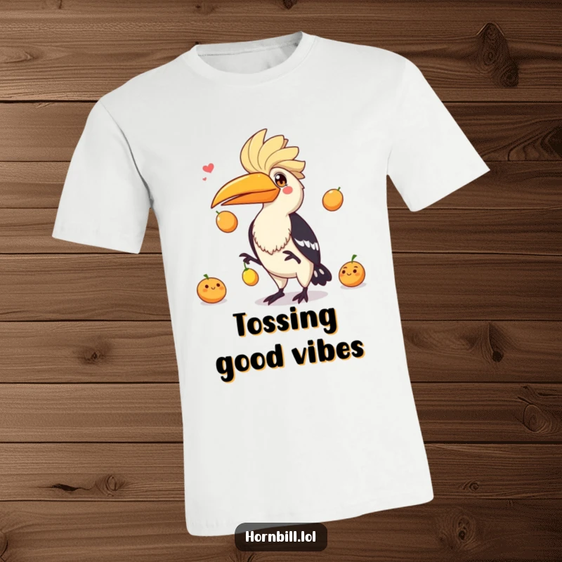 Funny hornbill with a mischievous grin juggling three bright fruits, captured in dynamic action on this t-shirt.